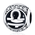 Detailed macro view of silver Libra zodiac bead charm with sparkling clear zircons - Libra
