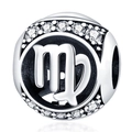 Macro view of silver Virgo zodiac charm with sparkling cubic zirconia stones and cutout - Virgo
