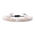 Detail of white volcanic stone beads and flat discs with black braided adjustable cord - Woven Style / White