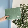Green corduroy cosmetic bag held by hand, minimalist large capacity makeup pouch storage - Grass Green