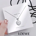 Elegant silver tulip heart necklace with sparkling diamonds on a display card - 1169 Heart Snowflake Necklace