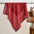 Detail of red square scarf with white leaf pattern and dark blue border on a hanger - 68*68cm / Red