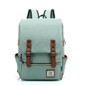 Front view of a vintage light green canvas travel backpack with brown faux leather straps - 14" / Light Green