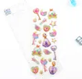 3D gold-stamped stickers featuring magic wands and moon heart shapes in pastel gradients - Sweetheart Magic