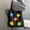 Zwarte canvas draagtas met kleurrijke bloemenprints en een comfortabele brede schouderriem - Vest Stijl Zwart