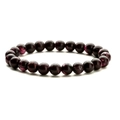 Close-up of deep purple imperial stone beaded bracelet with polished natural textures - Black Red