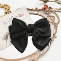 Large black satin bow hair clip with tiered layers and elegant spring fastener - Black