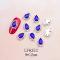 Macro detail of 9x12mm teardrop crystal nail charm with micro-pave silver bezel setting - Silver Base Dark Blue Teardrop (6353)