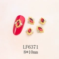 Close-up of red marquise nail gems with gold vintage alloy frames for 3D manicure art - Gold Base Red Marquise (6371)