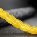 Polished honey amber oval beads for DIY jewelry making and round bead bracelets - Topaz