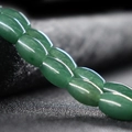 Glossy green oval natural jade beads for DIY jewelry making and bracelet assembly - Oily Green