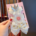 Detailed set of baby headbands featuring gold crowns and lace flowers on pink card - 3-21 Golden Crown Combination