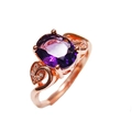 Elegant rose gold ring with oval purple amethyst gemstone and cubic zirconia leaf accents - Ring