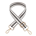 Macro detail of adjustable black and white chevron nylon strap with gold metal hooks - White Silver Buckle