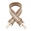 Detail of adjustable wide woven shoulder strap with geometric diamond pattern and gold hardware - Khaki