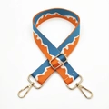 Detail of adjustable blue and orange jacquard bag strap with gold metal hooks and buckles - Sea Blue Orange
