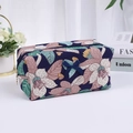 Trousse à maquillage bleu foncé à motif floral avec nœud bleu décoratif - Cyan
