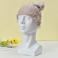 Minimalist beige textured knit beanie hat displayed on a model for winter warmth - Khaki