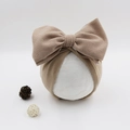 Detail of the soft faux cashmere material and large bow on the infant turban hat - Khaki