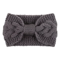 Detail of dark grey knit headband with chunky cable texture and oversized bow design - Medium Grey