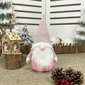 Pink Nordic Christmas gnome with white beard and knitted hat in a winter scene - Legless Faceless Doll Pink Style / Pink