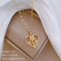 Detail of gold heart pendant with sunflower design, paved crystals and product dimensions - Gold Heart Sunflower Style