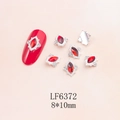 Macro detail of red marquise nail rhinestone charm in 8x10mm alloy vintage frame - Silver Base Red Marquise (6372)