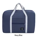 Foldable navy blue travel bag with large capacity and gray handles for easy organization - Navy Blue