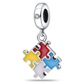 Detailed view of silver puzzle charm with red yellow blue and white enamel and a clear gem - Colorful Puzzle Series