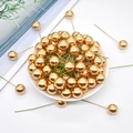 Golden Christmas berry bouquet floral stems on a white plate for festive decoration - 10mm / Gold