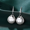 Elegant silver pearl earrings with sparkling zircons on a luxury dark green silk background - Earrings / White Gold Color (E3164)