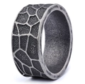 Macro shot of vintage silver ring featuring wide giraffe texture and oxidized steel finish - 23306