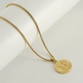 Gouden titanium stalen ketting met ronde Stier-sterrenbeeld hanger op standaard - Stier