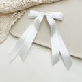 Detail of elegant white double-layered satin bow hair clip with long silk ribbons - White