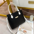Classic black and white contrast leather handbag with gold metal accents and shoulder strap - Black