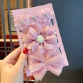 Detailed close-up of a three-piece set of pink lace flowers and mesh bow baby headbands - 3-20 Pink Lace Flower Combination