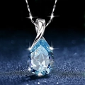 Silver necklace featuring a sparkling blue teardrop crystal pendant on a dark background - Tears of Goddess [Blue Teardrop Pendant - No Chain]