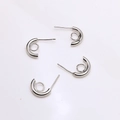 Macro shot of silver S925 C-shaped earring posts with small loop for DIY jewelry making - Silver Semi-Circle With Loop