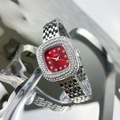 Close-up of diamond-bezel women's watch with red dial and silver stainless steel strap - Silver Red Face