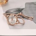 Detail of rose gold ladies' watch with small white dial and sparkling rhinestone bracelet - Silver