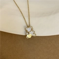 Gold bear pendant necklace with white shell inlay and Love heart charm on a delicate chain - Bear with Heart