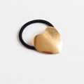 Golden heart-shaped metal hair tie with a black elastic cord on a white background - Metal / Heart Gold