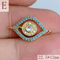 Macro shot of gold Evil Eye charm with blue and white stones, size 22.5x12mm - Style E (22.5*12mm)
