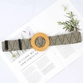 Detail of black and white herringbone woven belt with round wooden buckle on magazine - Big Round Buckle Multicolor