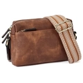 Detail view of brown leather crossbody bag with striped strap and gold metal hardware - Dark Brown