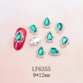 Detail of 9x12mm emerald teardrop nail charm with silver hollow filigree and vintage base - Silver Base Emerald Green Teardrop (6355)