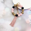 Pink and black silicone bead bracelet keychain with leopard wood bead and tassel charm - Light Pink