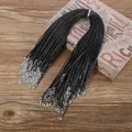 Bulk pack of black wax cord necklaces with silver lobster clasps on wooden surface - Leather Cord