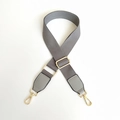 Detail of adjustable gray canvas strap with gold metal lobster clasps and leather ends - Gray / Silver