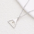 Macro detail of silver stainless steel mountain peak pendant with Faith mustard seed - Steel Mountain